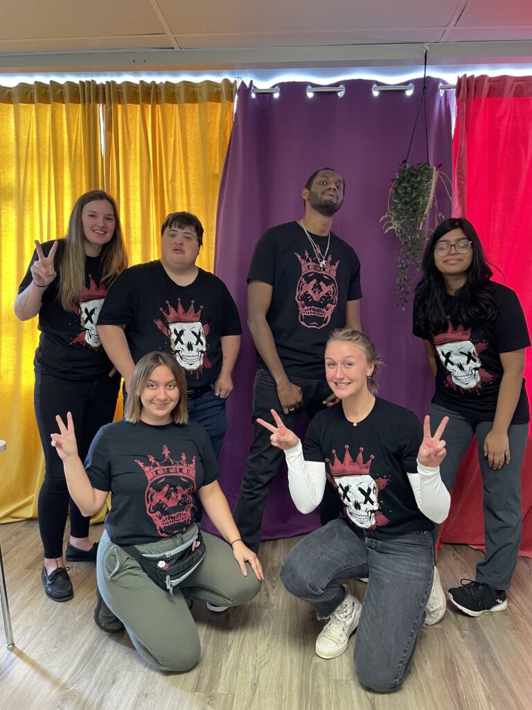 Moe and the Adults in Motion team wearing Skull King shirts